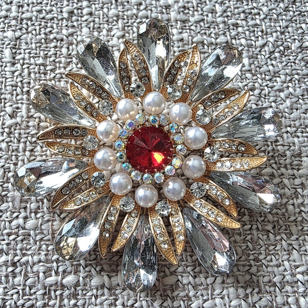 Vintage gold tone flower brooch featuring Red & Clear Crystals & Pearls
